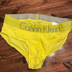 NWOT. Calvin Klein men’s briefs, size Med. Yellow